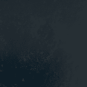 A dark, textured surface with subtle speckles, like a GRP Pitched Window Roof.