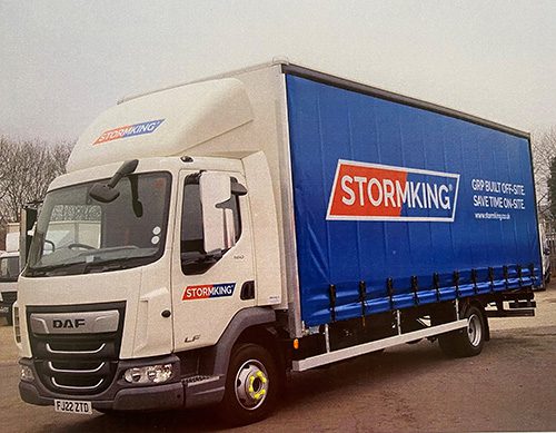 A white truck with a blue Stormking-branded trailer, a leading name in GRP supply